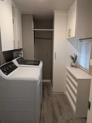 a utility room with washer and dryer