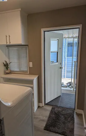 a kitchen with a sink and refrigerator
