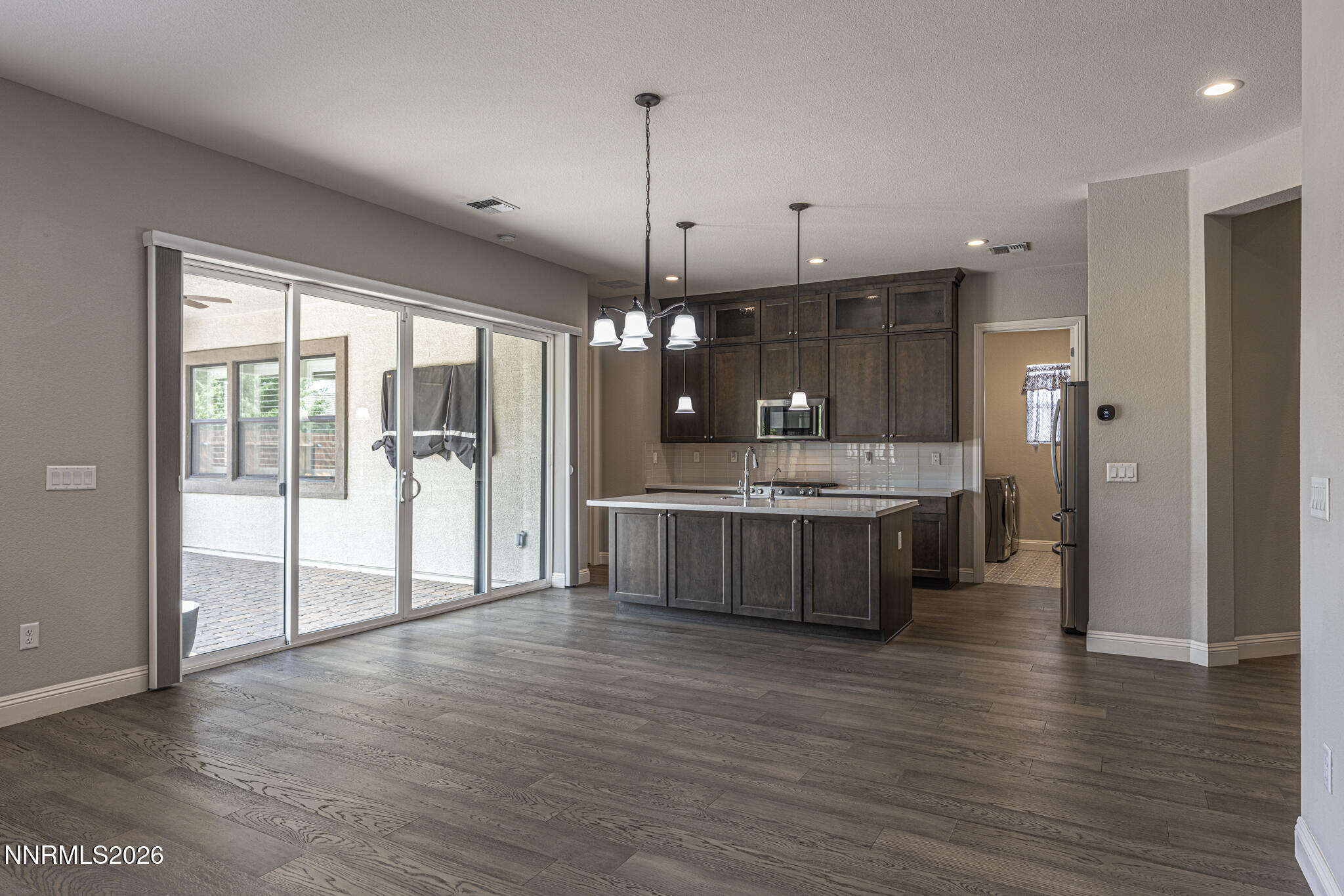 2109 Cast Iron Drive Reno, NV 89521 - Photo 4 of 35 a large kitchen with a lot of cabinets and wooden floor