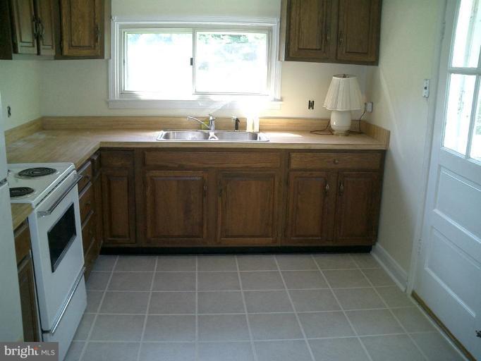2924 Ridge Road Windsor Mill, MD 21244 - Photo 7 of 14 Kitchen with sm table area and new tile floor