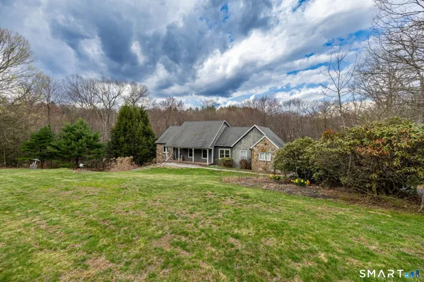 a view of big yard in front of house