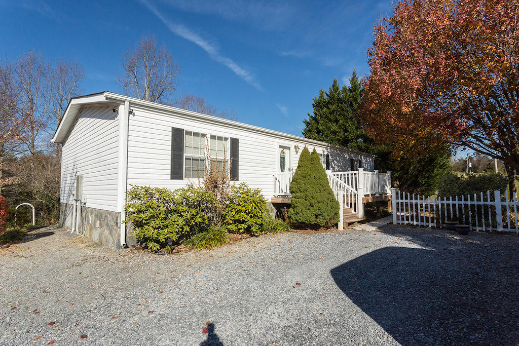 101 Crest Court Blue Ridge, VA 24064 - Photo 2 of 35 a front view of a house with garden