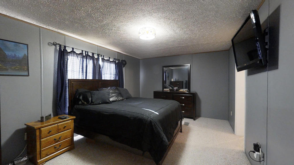 101 Crest Court Blue Ridge, VA 24064 - Photo 12 of 35 a bedroom with a bed and furniture