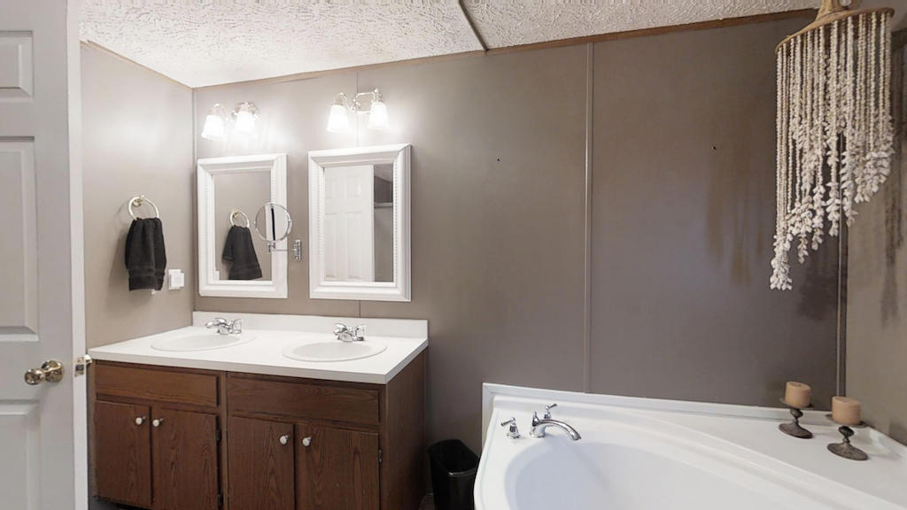 101 Crest Court Blue Ridge, VA 24064 - Photo 15 of 35 a bathroom with a sink and a mirror