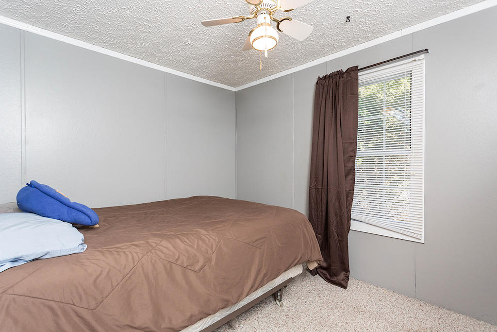 101 Crest Court Blue Ridge, VA 24064 - Photo 18 of 35 a bedroom with a bed and window