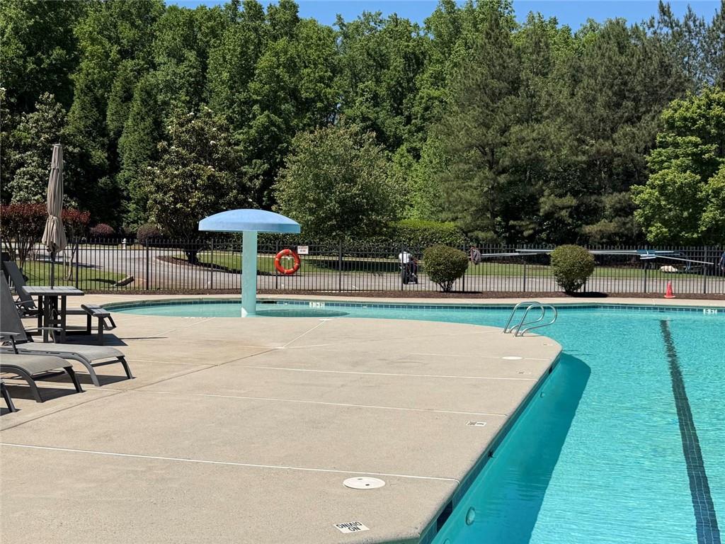 7610 Scenic Overlook Cumming, GA 30041 - Photo 51 of 62 a view of a swimming pool with a patio