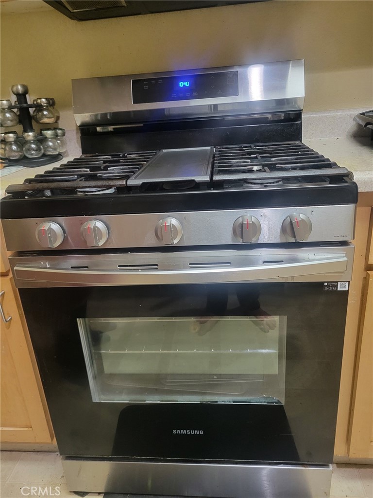 2177 Alum Rock Avenue, Unit 211 San Jose, CA 95116 - Photo 65 of 68 a stove top oven sitting inside of a kitchen