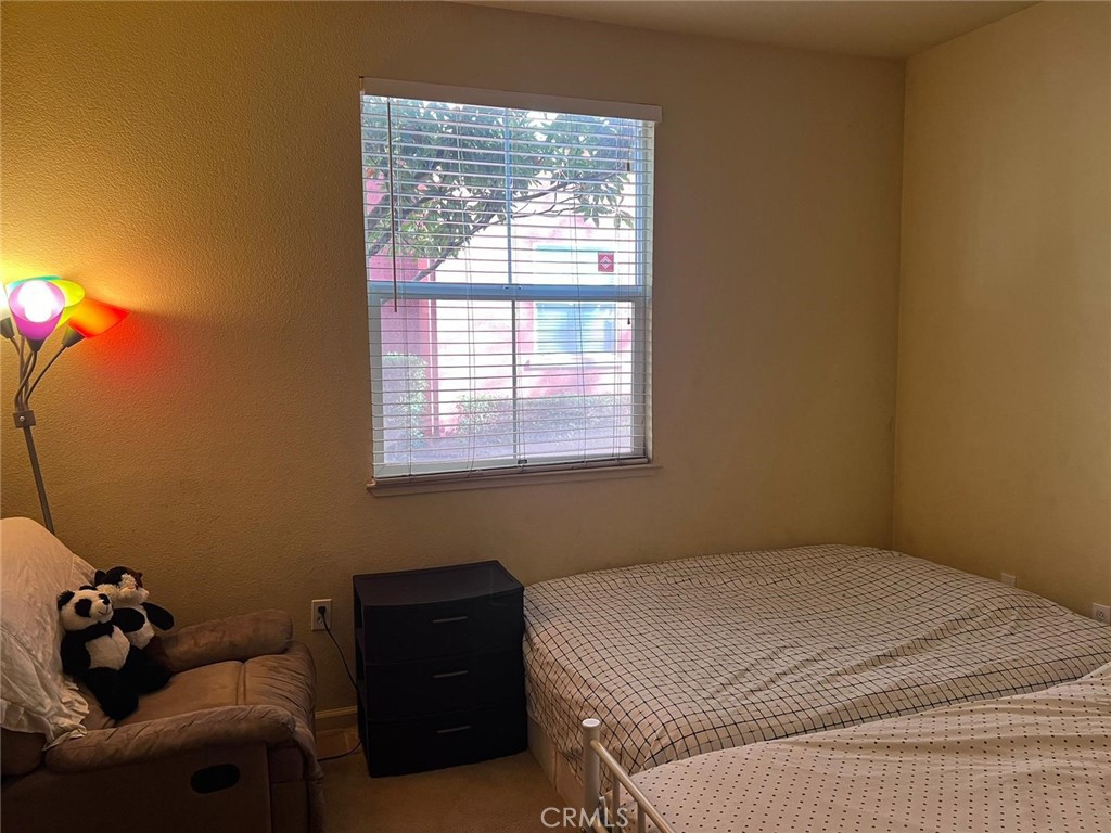 2177 Alum Rock Avenue, Unit 211 San Jose, CA 95116 - Photo 8 of 68 a bedroom with a bed and a window
