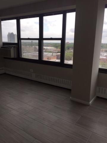 6030 North Sheridan Road, Unit 1207 Chicago, IL 60660 - Photo 3 of 10 a view of an empty room with a window