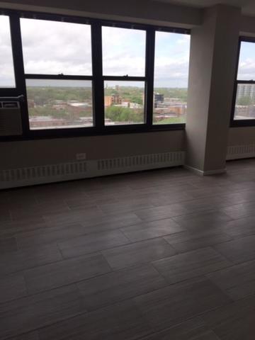 6030 North Sheridan Road, Unit 1207 Chicago, IL 60660 - Photo 4 of 10 a view of an empty room with a window