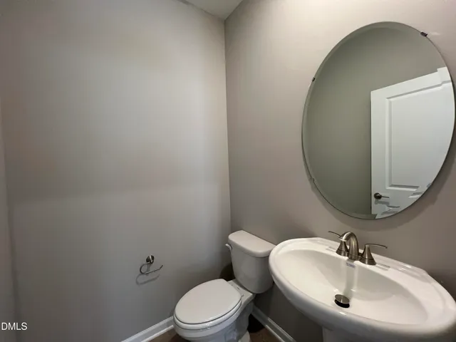 a bathroom with a double vanity sink and mirror