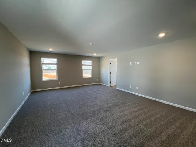 an empty room with a empty space and window