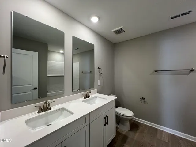 a black and white photo of a open kitchen
