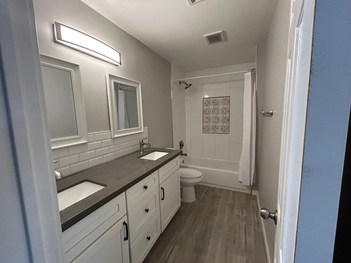 1117 West 9th Street Tempe, AZ 85281 - Photo 13 of 22 a bathroom with a granite countertop sink mirror vanity and toilet