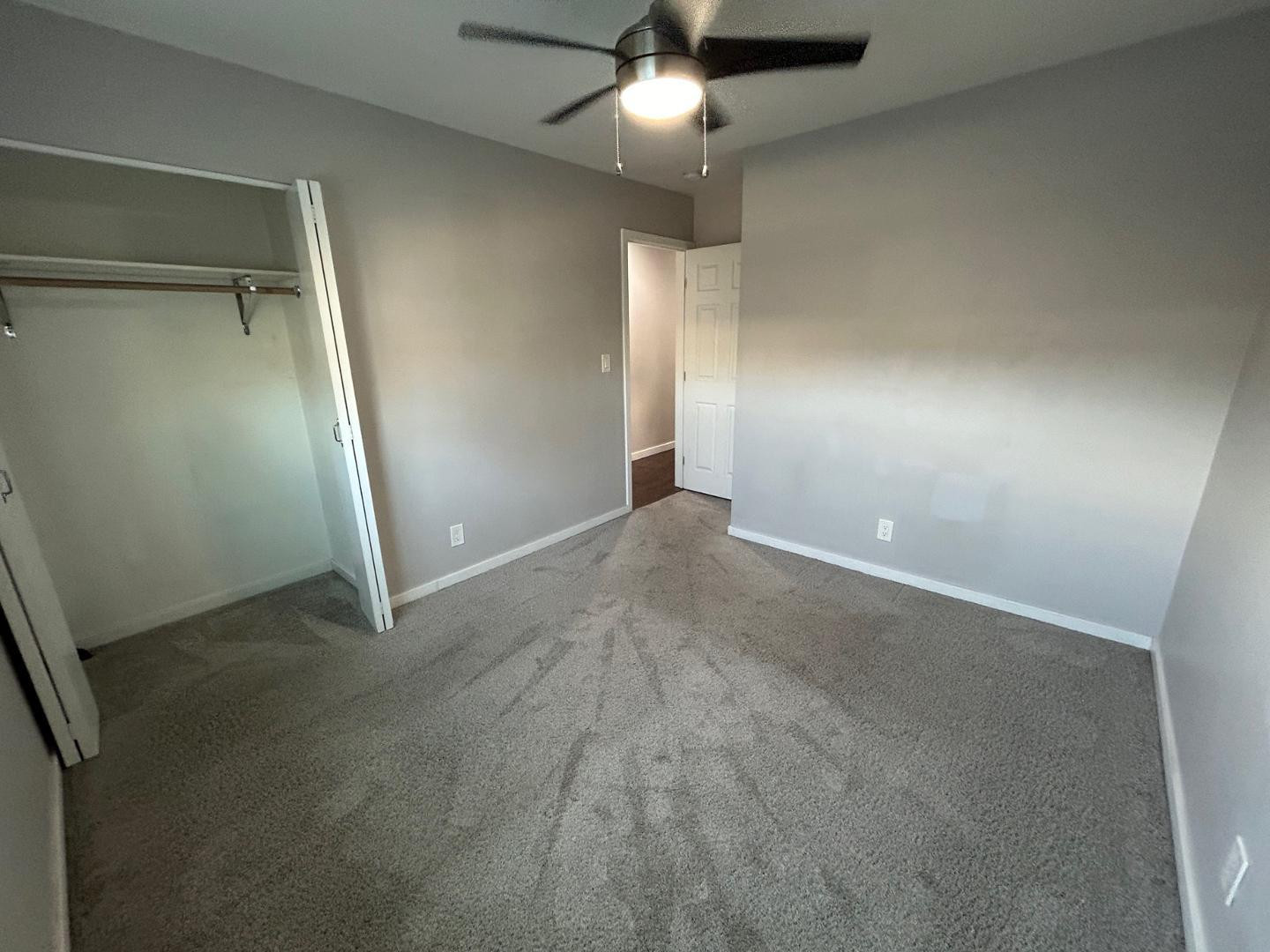 1117 West 9th Street Tempe, AZ 85281 - Photo 15 of 22 an empty room with closet and a chandelier fan