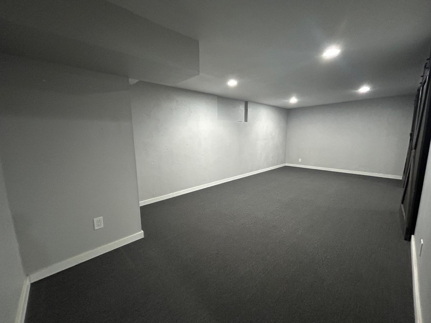 1117 West 9th Street Tempe, AZ 85281 - Photo 19 of 22 an empty room with a wooden floor and windows