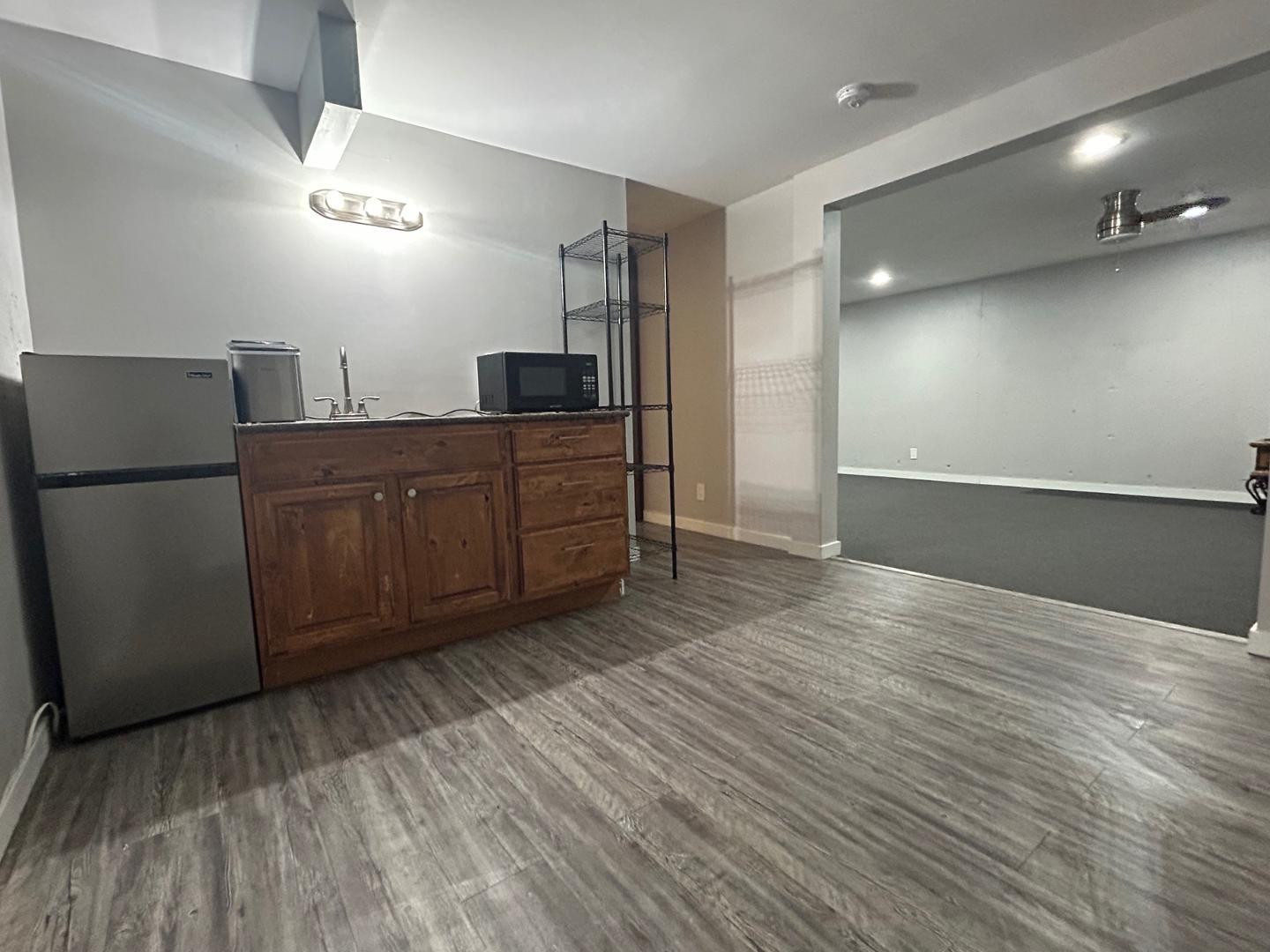 1117 West 9th Street Tempe, AZ 85281 - Photo 22 of 22 a kitchen with stainless steel appliances a refrigerator and wooden floor