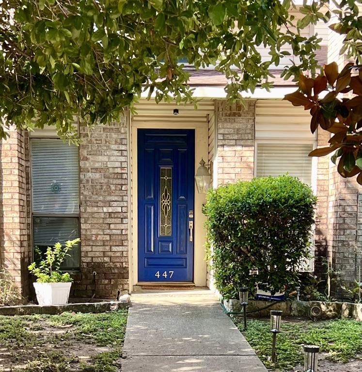 a front view of a house with yard