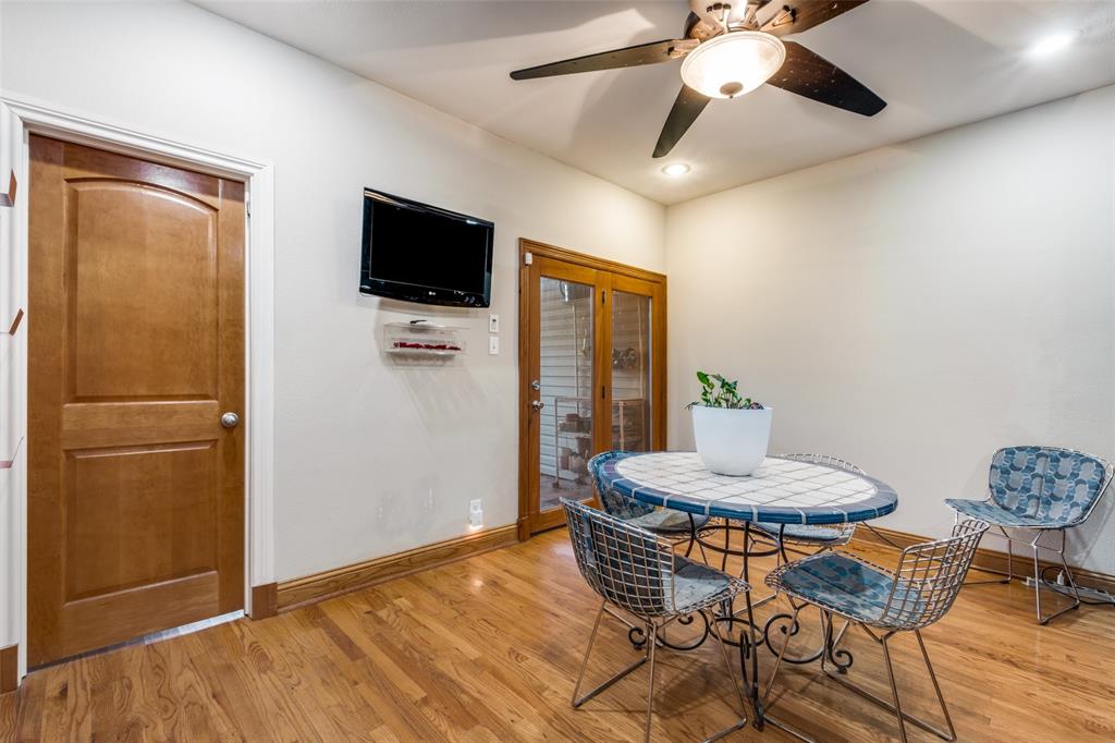 447 Josephine Street Dallas, TX 75246 - Photo 14 of 26 a living room with furniture and a flat screen tv