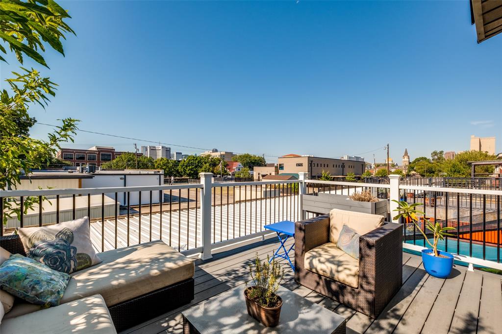 447 Josephine Street Dallas, TX 75246 - Photo 23 of 26 a view of a balcony with two chairs and a table