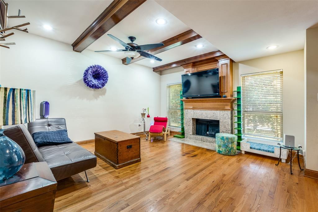 447 Josephine Street Dallas, TX 75246 - Photo 5 of 26 a living room with furniture and a fireplace
