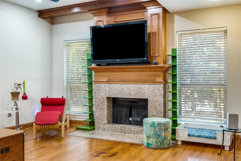 447 Josephine Street Dallas, TX 75246 - Photo 8 of 26 a living room with furniture and a fireplace