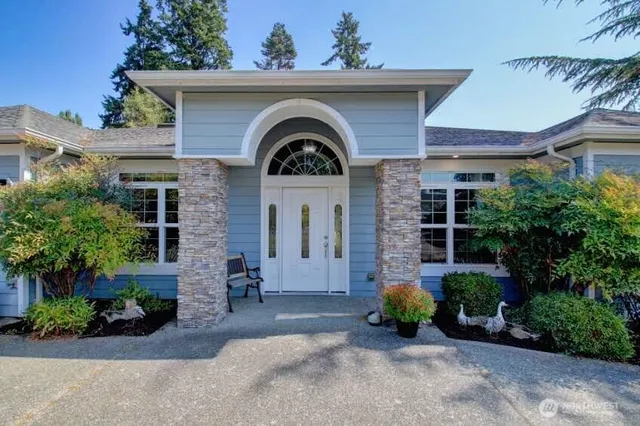 a front view of a house with garden