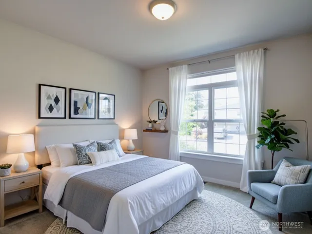 a bedroom with bed and a couch