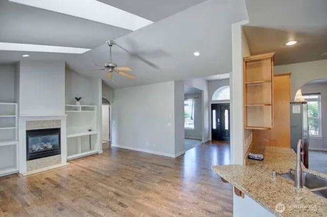 a view of a kitchen cabinets and a wooden floor