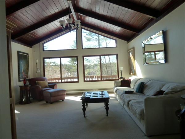 108 Poor Farm Road Harvard, MA 01451 - Photo 3 of 9 a living room with furniture and a large window