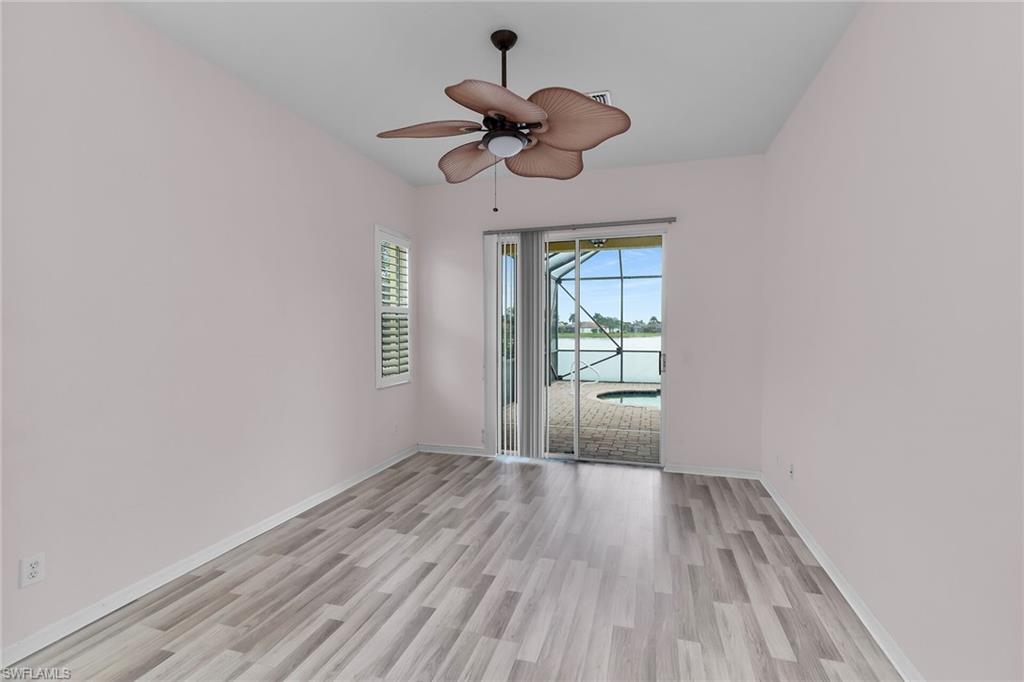2880 Orange Grove Trail Naples, FL 34120 - Photo 12 of 42 a view of empty room with wooden floor