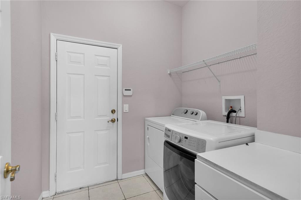 2880 Orange Grove Trail Naples, FL 34120 - Photo 19 of 42 a utility room with dryer and washer