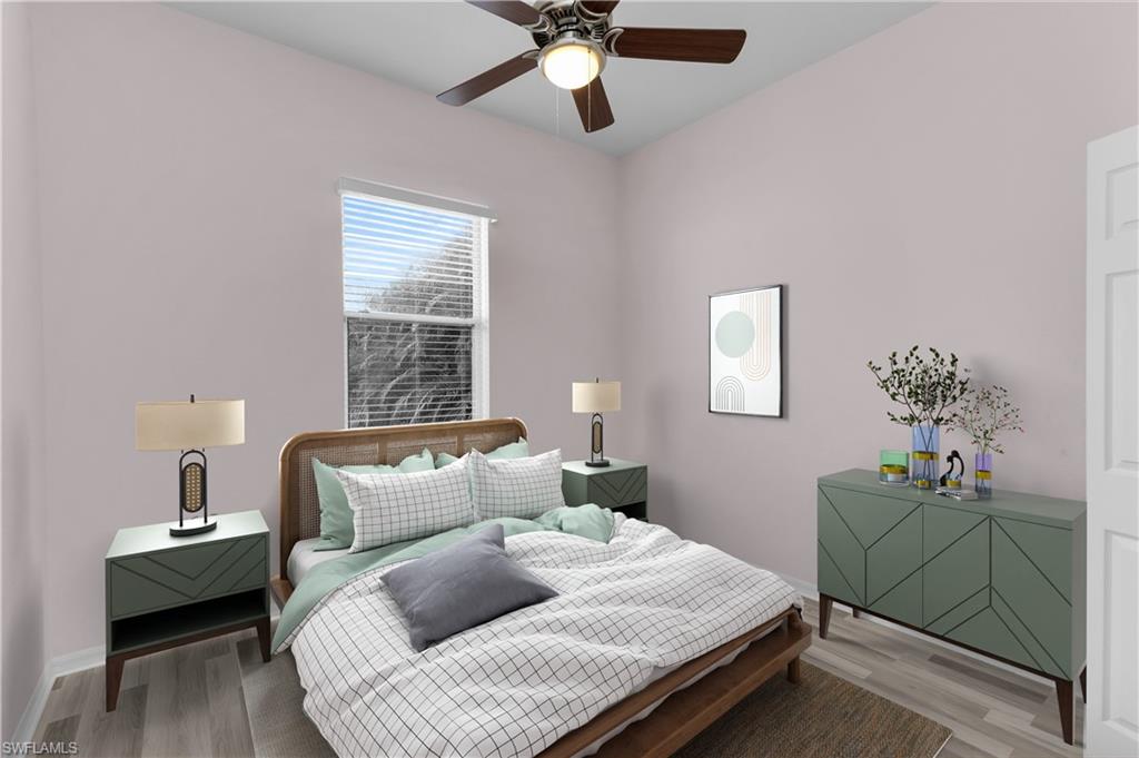 2880 Orange Grove Trail Naples, FL 34120 - Photo 20 of 42 a bedroom with a bed and window