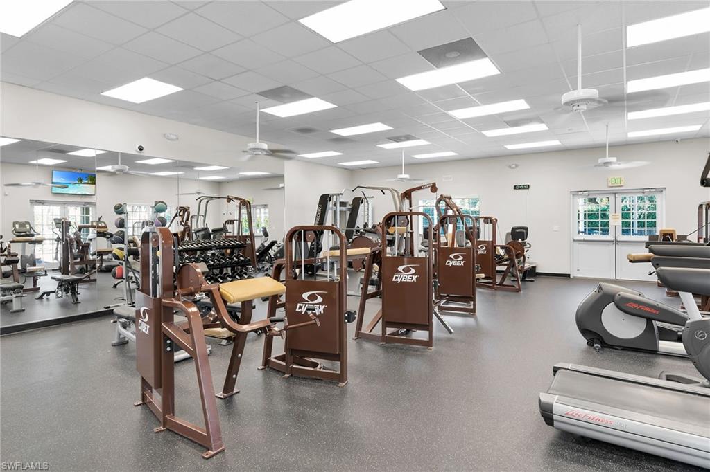 2880 Orange Grove Trail Naples, FL 34120 - Photo 27 of 42 a room with gym equipment and lots of equipment