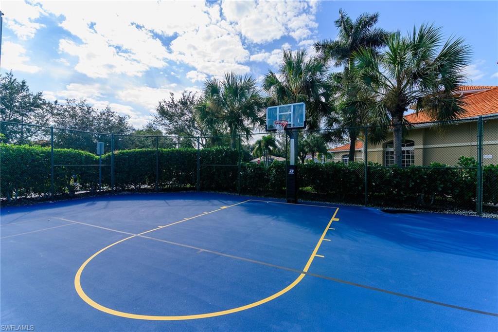 2880 Orange Grove Trail Naples, FL 34120 - Photo 34 of 42 a view of a swimming pool with a yard