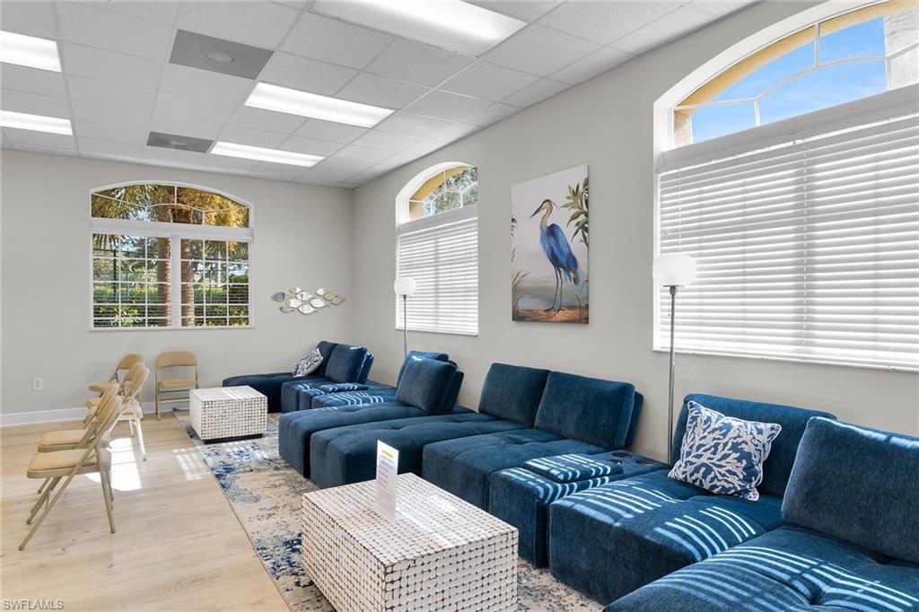 2880 Orange Grove Trail Naples, FL 34120 - Photo 37 of 42 a living room with furniture and a large window