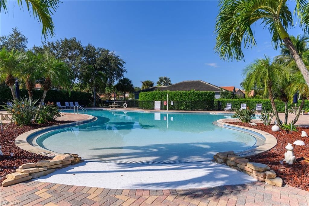 2880 Orange Grove Trail Naples, FL 34120 - Photo 38 of 42 a view of a swimming pool with a yard