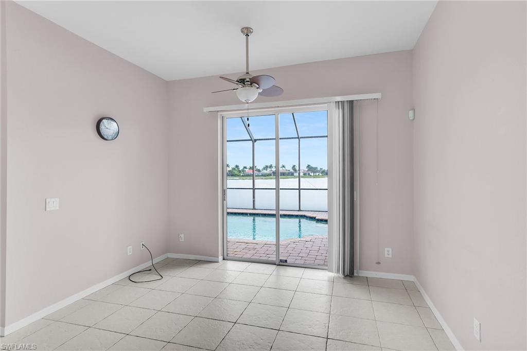 2880 Orange Grove Trail Naples, FL 34120 - Photo 8 of 42 a view of an empty room with a window