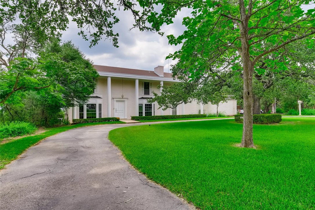 1400 The High Road Austin, TX 78746 - Photo 1 of 1 a front view of a house with a yard