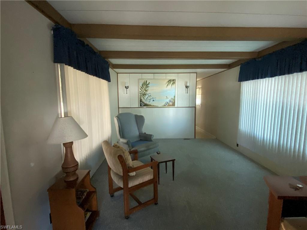 26 Cheyenne Trail, Unit 168 Naples, FL 34113 - Photo 15 of 21 a view of room with window and furniture