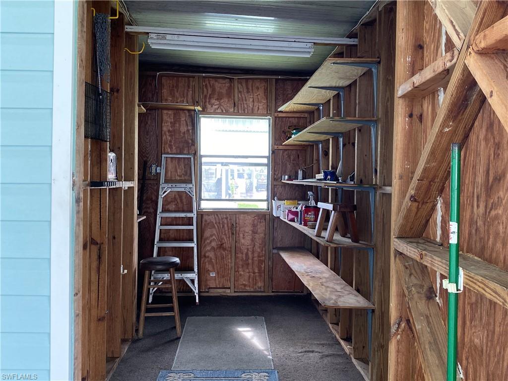 26 Cheyenne Trail, Unit 168 Naples, FL 34113 - Photo 7 of 21 a view of staircase with wooden floor and stairs