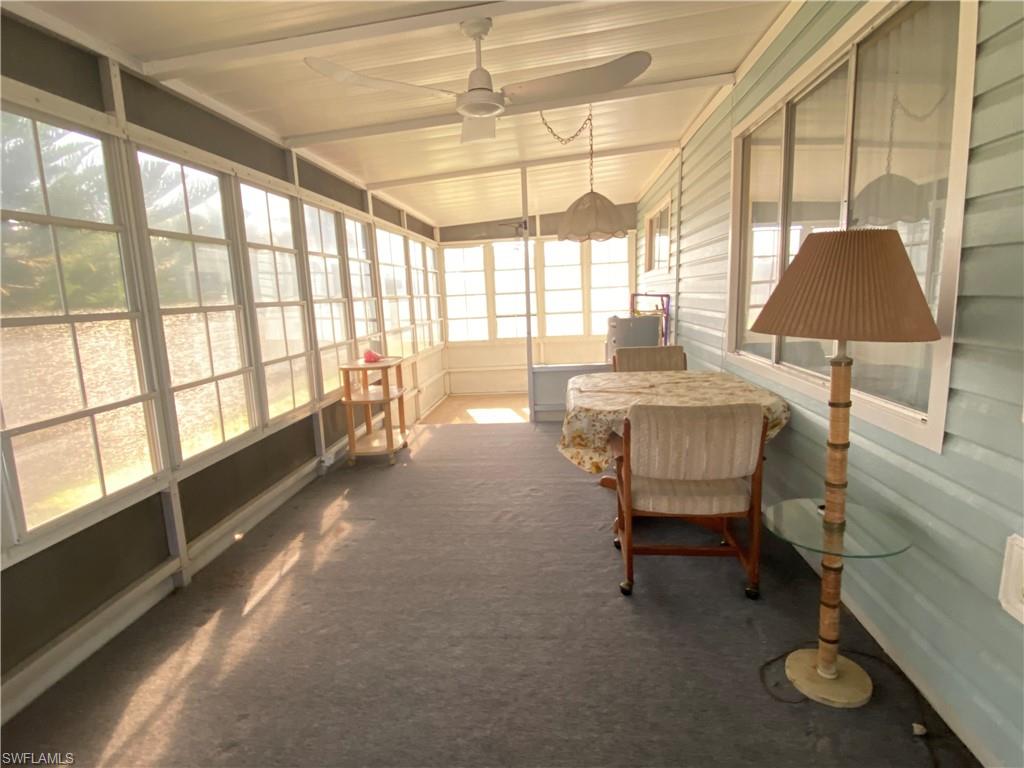26 Cheyenne Trail, Unit 168 Naples, FL 34113 - Photo 10 of 21 a dining room with furniture and a window