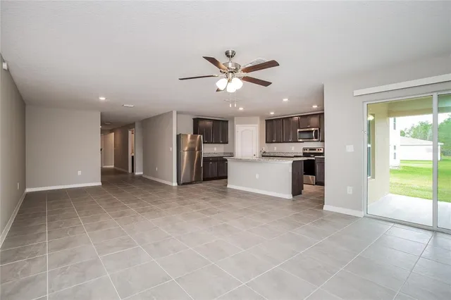 a view of a kitchen with a stove cabinets and a kitchen