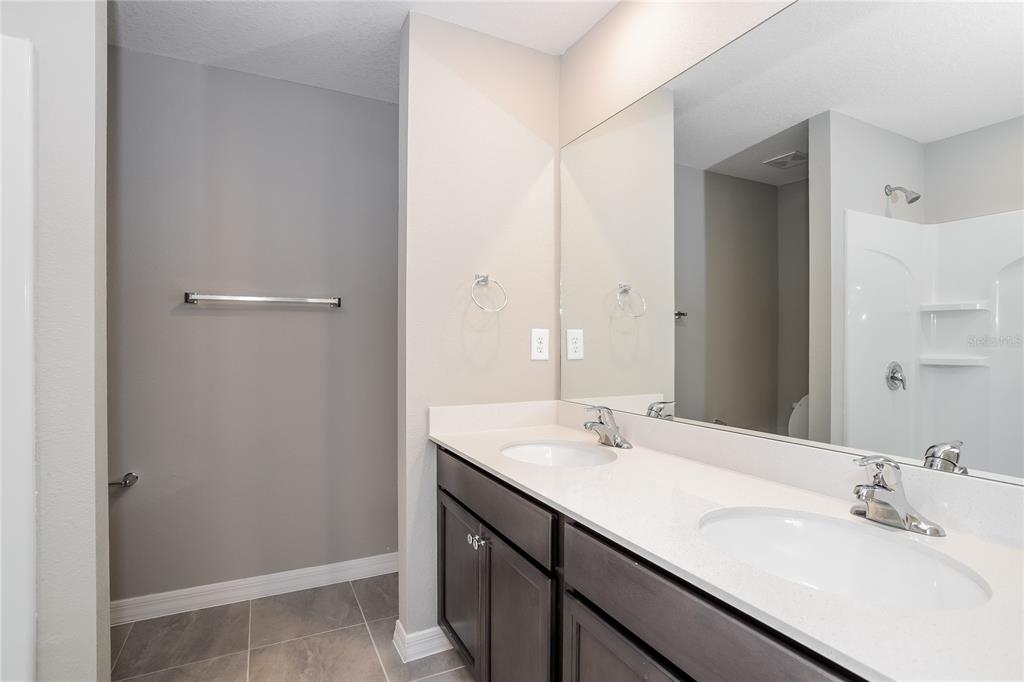 349 Daffodil Lane Kissimmee, FL 34759 - Photo 7 of 16 a bathroom with a sink and a mirror