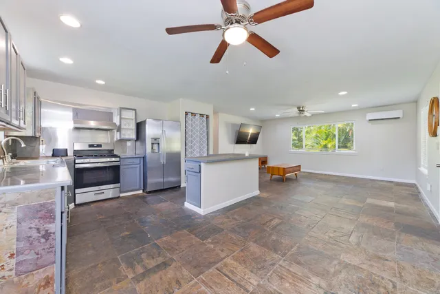 a view of a kitchen with furniture and a kitchen
