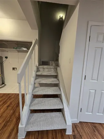 an empty room with closet and a ceiling fan