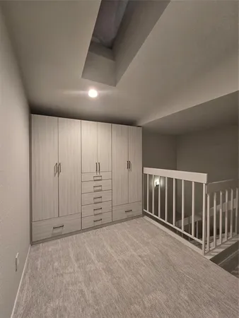 a bathroom with a tub a sink and a shower