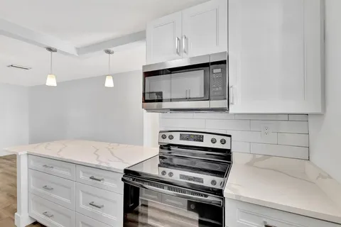 wooden view of outdoor space with swimming pool and green space