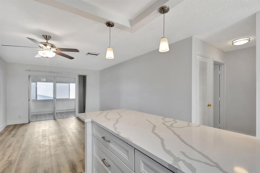 300 Southwest Golfview Terrace, Unit 131 Boynton Beach, FL 33426 - Photo 14 of 57 a view of a kitchen and a sink dishwasher with wooden floor