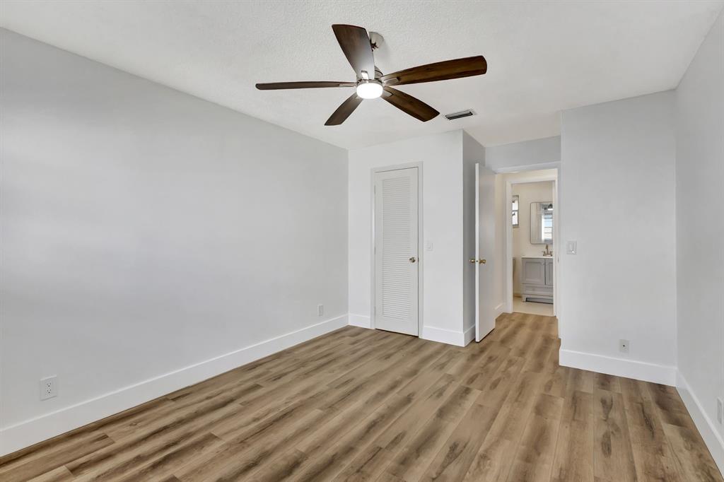 300 Southwest Golfview Terrace, Unit 131 Boynton Beach, FL 33426 - Photo 25 of 57 a view of empty room with wooden floor